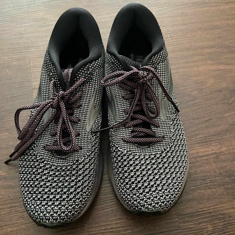 Brooks tennis shoes. Purple metallic bottom. Worn a few times. Size 7